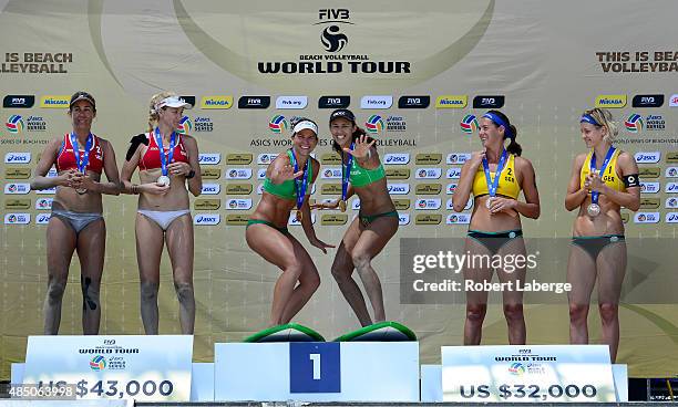 April Ross and Kerri Walsh of the USA, silver medal, Larissa Franca Maestrini and Talita Da Rocha Antunes of Brazil, gold medal and Kira Walkenhorst...