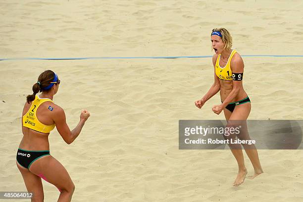 Kira Walkenhorst and Laura Ludwig of Germany celebrate a winning point during the 2015 ASICS World Series of Beach Volleyball at the TrueCar Course...