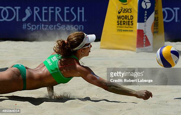 Larissa Franca Maestrini of Brazil dives for the Mikasa during the 2015 ASICS World Series of Beach Volleyball at the TrueCar Course at Alamitos...