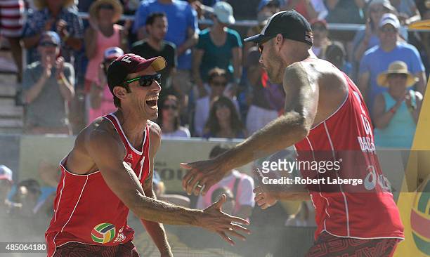 Nicholas Lucena of the USA celebrates a point with Philip Dalhausser during the 2015 ASICS World Series of Beach Volleyball at the TrueCar Course at...