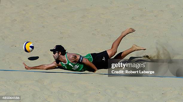 Bruno Oscar Schmidt of Brazil dives for the ball during the 2015 ASICS World Series of Beach Volleyball at the TrueCar Course at Alamitos Beach on...