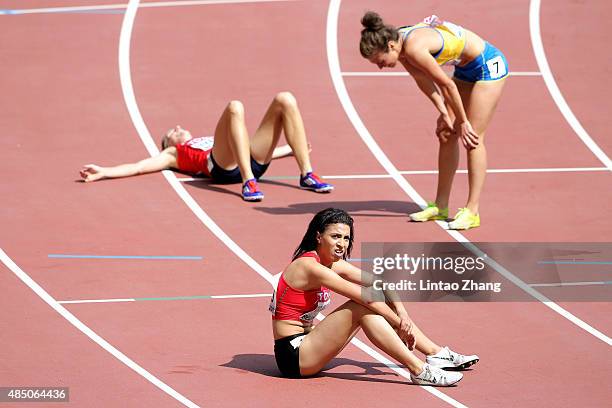Salima Elouali Alami of Morocco catches her breath after crossing the finish line in the Women's 3000 metres steeplechase heats during day three of...