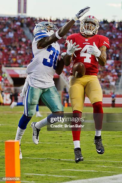 Lache Seastrunk of the Dallas Cowboys breaks up what could have been a touchdown pass to wide receiver Nigel King of the San Francisco 49ers in the...