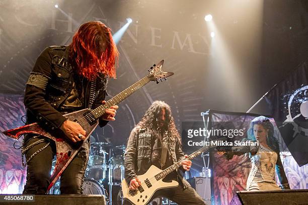 Guitarist Michael Amott, bassist Sharlee D'Angelo and vocalist Alissa White-Gluz of Arch Enemy perform during The Summer Slaughter Tour at The...