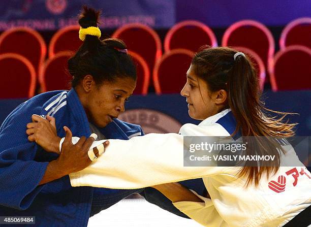 Cuba's judoka Dayaris Mestre Alvarez competes with Priscilla Morand from Mauritius during the womens qualification match, in the -48 kg category at...