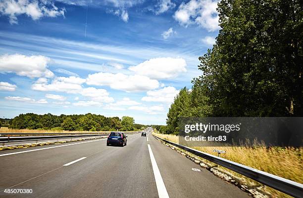 cars travelling on french autoroute - autoroute france stock pictures, royalty-free photos & images
