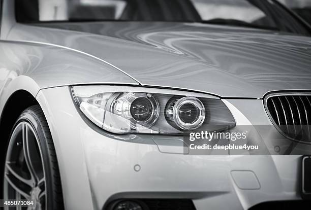 bmw xenon car head light - bmw stock pictures, royalty-free photos & images