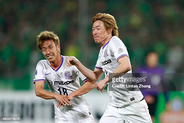 Naoki Ishihara with teammate Yoshifumi Kashiwa of Sanfrecce Hiroshima celebrates scoring their second goal during the AFC Champions match between...