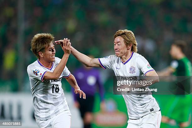 Naoki Ishihara with teammate Yoshifumi Kashiwa of Sanfrecce Hiroshima celebrates scoring their second goal during the AFC Champions match between...