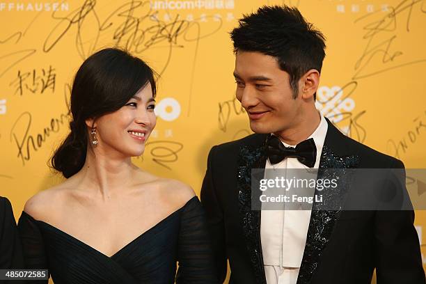 Korean actress Song Hye Kyo and Chinese actor Huang Xiaoming arrive for the red carpet of 4th Beijing International Film Festival at China's National...