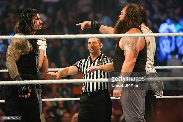 Roman Reigns and Bray Wyatt stare each other down at the WWE SummerSlam 2015 at Barclays Center of Brooklyn on August 23, 2015 in New York City.