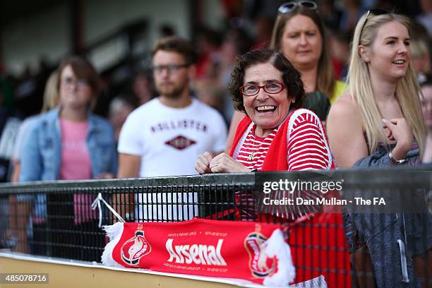 An Arsenal fan proudly displays her team scarf prior to the FA WSL match between Arsenal Ladies and Chelsea Ladies at Meadow Park on August 23, 2015...