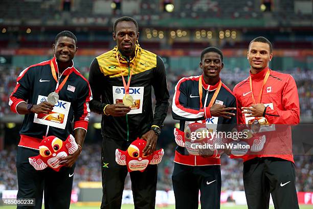 Silver medalist Justin Gatlin of the United States, gold medalist Usain Bolt of Jamaica and joint bronze medalists Trayvon Bromell of the United...
