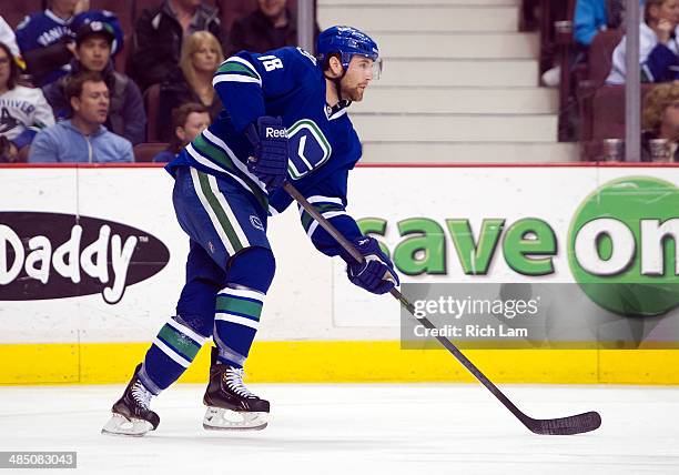 Ryan Stanton of the Vancouver Canucks skates with the puck during NHL action against the Colorado Avalanche on April 10, 2014 at Rogers Arena in...