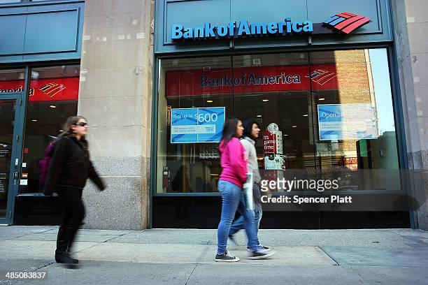 People walk past a Bank of America branch on April 16, 2014 in New York City. As the nation's second-largest bank continues to struggle with fallout...