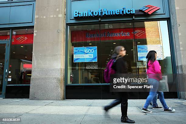 People walk past a Bank of America branch on April 16, 2014 in New York City. As the nation's second-largest bank continues to struggle with fallout...