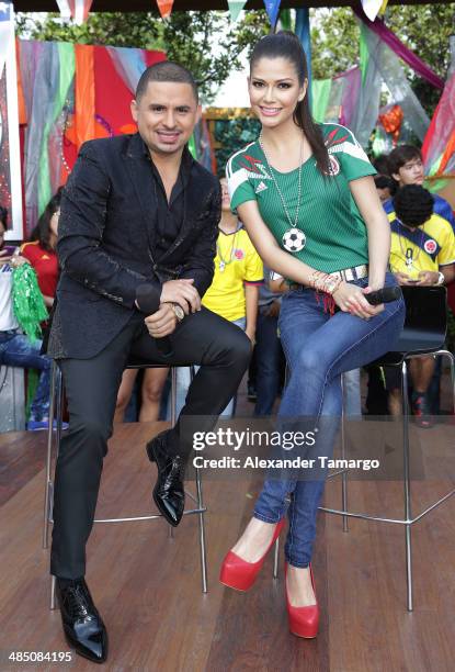 Larry Hernandez and Ana Patricia Gonzalez pose during FIFA World Cup Trophy Tour on the set of Despierta America at Univision Headquarters on April...