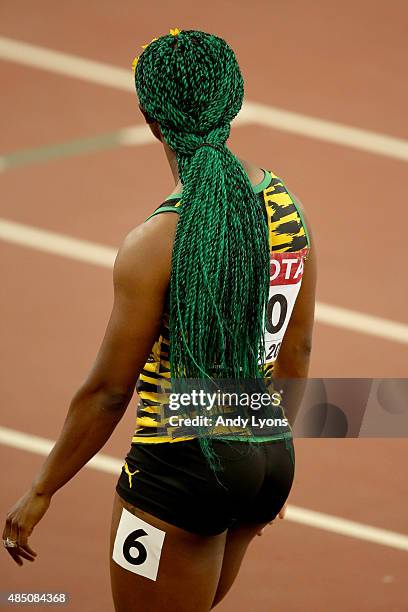 Shelly-Ann Fraser-Pryce of Jamaica reacts after competing in the Women's 100 metres semi-final during day three of the 15th IAAF World Athletics...