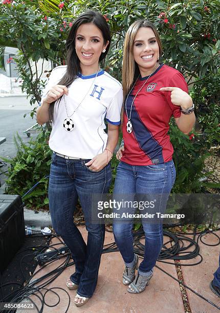 Maity Interiano and Andrea Chediak pose during FIFA World Cup Trophy Tour on the set of Despierta America at Univision Headquarters on April 16, 2014...