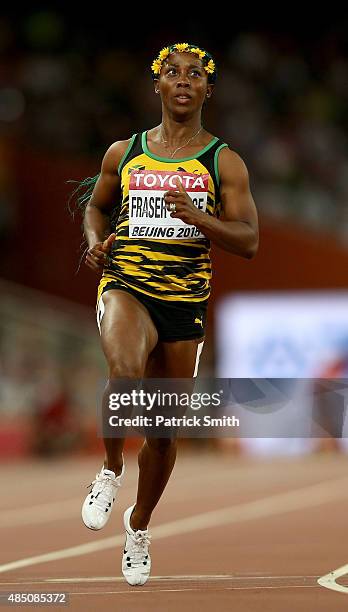 Shelly-Ann Fraser-Pryce of Jamaica competes in the Women's 100 metres semi-final during day three of the 15th IAAF World Athletics Championships...