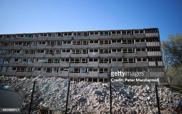 Block of flats at former Heygate public housing estate sits above rubble on April 16, 2014 in London, England. The site has been bought from the...