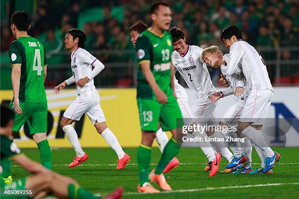 Kohei Shimizu of Sanfrecce Hiroshima celebrates with team mates after scoring the second goal during the AFC Champions match between Sanfrecce...