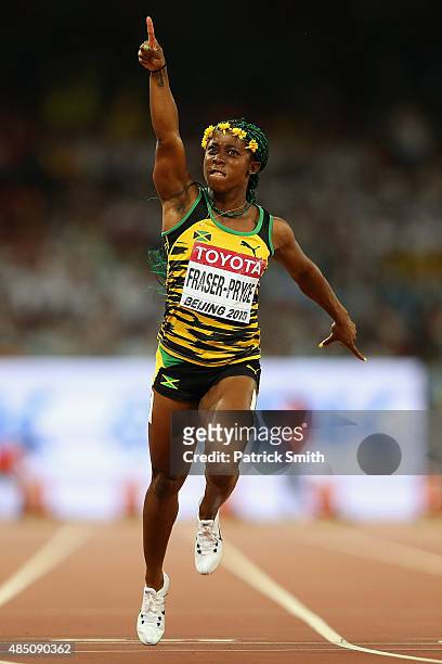 Shelly-Ann Fraser-Pryce of Jamaica crosses the finish line to win gold in the Women's 100 metres final during day three of the 15th IAAF World...