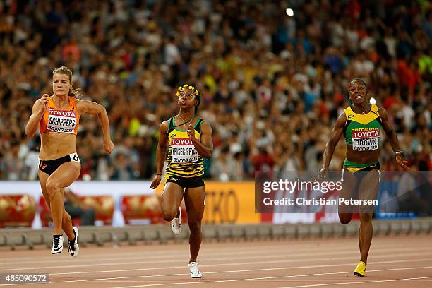 Shelly-Ann Fraser-Pryce of Jamaica beats Dafne Schippers of the Netherlands and Veronica Campbell-Brown of Jamaica to win gold in the Women's 100...