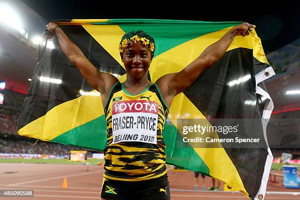 Shelly-Ann Fraser-Pryce of Jamaica celebrates after winning gold in the Women's 100 metres final during day three of the 15th IAAF World Athletics...