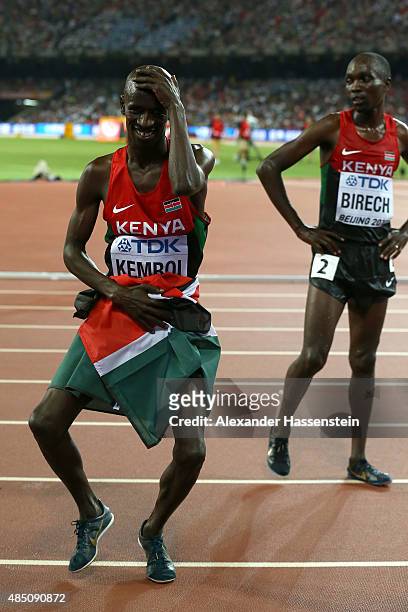 Ezekiel Kemboi of Kenya celebrates after winning gold in the Men's 3000 metres steeplechase final as Jairus Kipchoge Birech of Kenya looks on during...