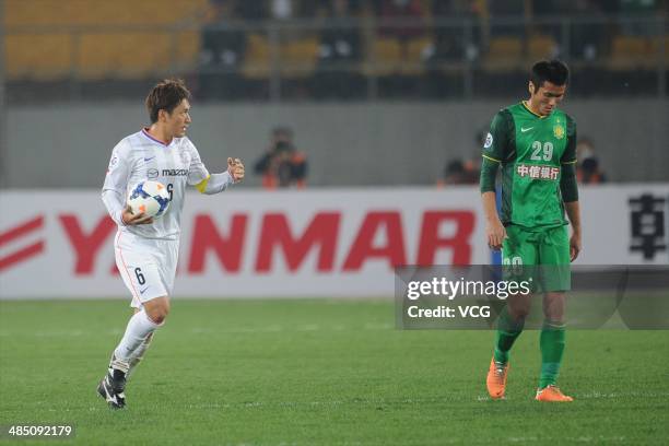 Toshihiro Aoyama of Sanfrecce Hiroshima celebrates after team mate Naoki Ishihara scored their team's first goal during the Asian Champions League...