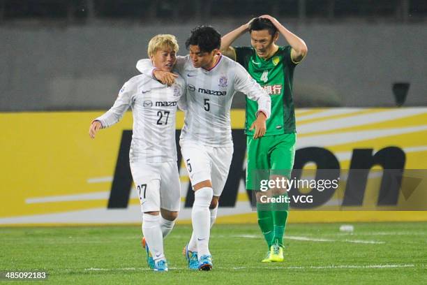 Kohei Shimizu and Kazuhiko Chiba of Sanfrecce Hiroshima celebrate after team mate Naoki Ishihara scored their team's second goal to equalise during...