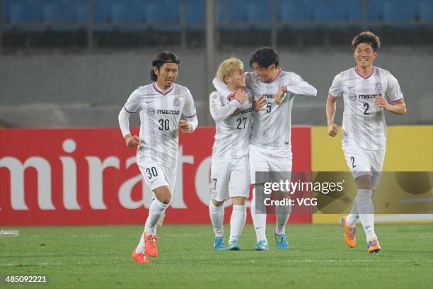 Kosei Shibasaki, Hwang Seok-Ho, Kohei Shimizu and Kazuhiko Chiba of Sanfrecce Hiroshima celebrate after team mate Naoki Ishihara scored their team's...