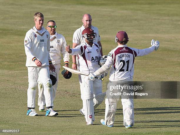 Mohammad Azharullah and Rob Newton of Northamptonshire celebrate as they hold on for a ninth wicket stand to enable Northamptonshire to obtain a draw...