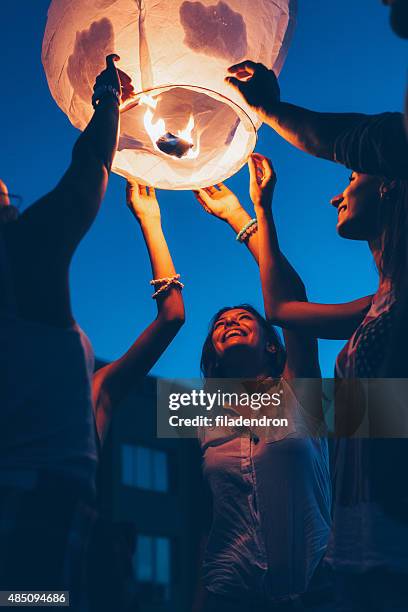 chinese lanthern - releasing lanterns stock pictures, royalty-free photos & images