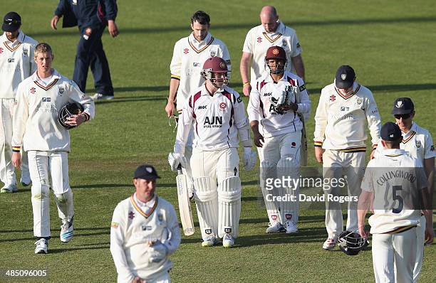 Mohammad Azharullah and Rob Newton of Northamptonshire walk off the pitch as they hold on for a ninth wicket stand to enable Northamptonshire to...