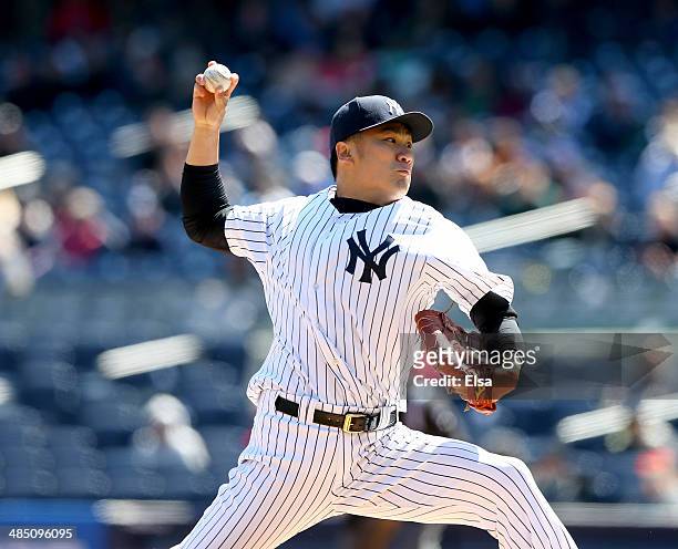 Masahiro Tanaka of the New York Yankees delivers a pitch in the first inning against the Chicago Cubs during game one of a doubleheader on April 16,...