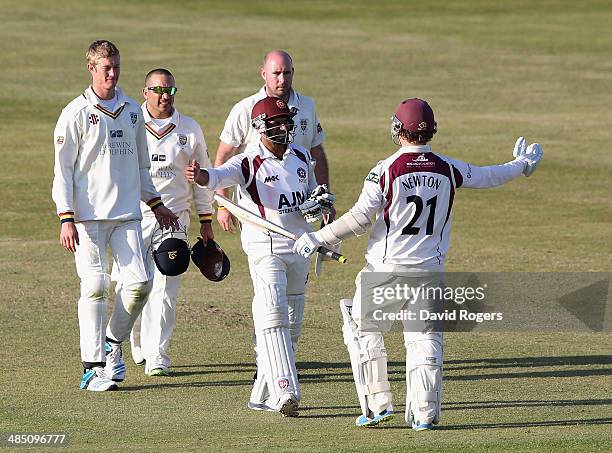 Mohammad Azharullah and Rob Newton of Northamptonshire celebrate as they hold on for a ninth wicket stand to enable Northamptonshire to obtain a draw...