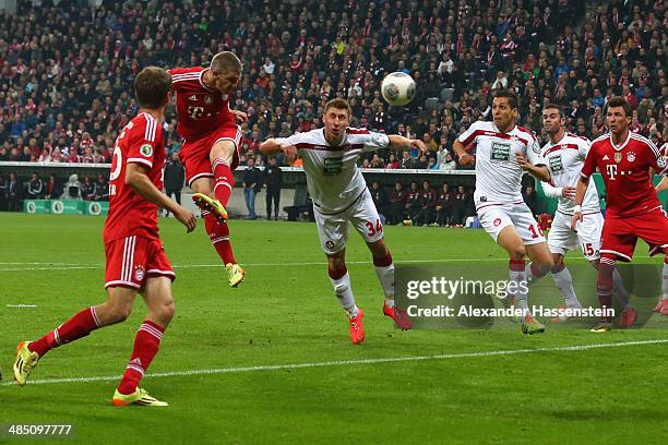 Bastian Schweinsteiger of Muenchen scores the opening goal during the DFB Cup semi final match between FC Bayern Muenchen and 1. FC Kaiserslautern at...
