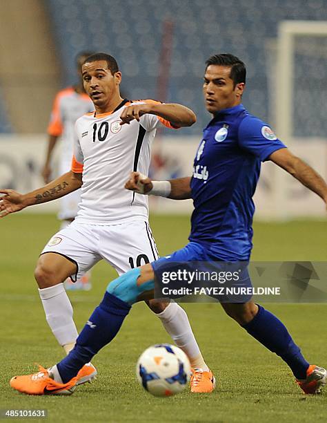 Saudi's Al-Shabab midfielder Macnelly Torres Berrio passes the ball past Iran's Isteghlal defender Amir Hossein Sadeghi during their AFC Champions...