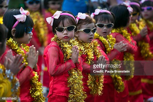 Young Burmese dancers practice their dance waiting to take part in the closing ceremony during festivities on the fourth day of the Burmese new year...