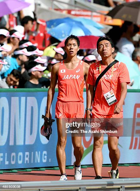 Yusuke Suzuki of Japan retires from the Men's 20km Race Walk final during day two of the 15th IAAF World Athletics Championships Beijing 2015 at...