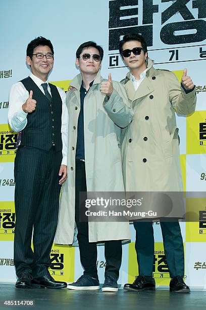 South Korean actors Sung Dong-Il, director Kim Jung-Hoon and Kwon Sang-Woo attend the press conference for 'Accidental Detective' at CGV on August...