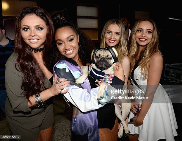 Jesy Nelson, Leigh0Anne Pinnock, Perrie Edwards, and Jade Thirlwall of Little Mix pose with internet celebrity dog Doug the Pug backstage during...