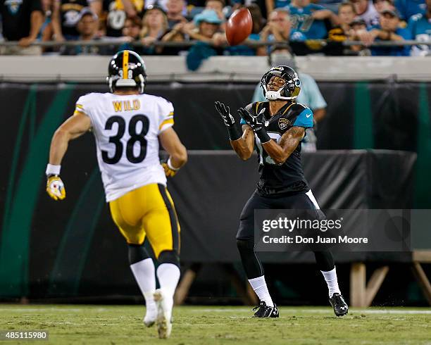 Wide Receiver Rashad Greene of the Jacksonville Jaguars on a punt return over Safety Ian Wild of the Pittsburgh Steelers during a preseason game at...