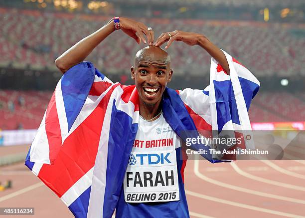 Mohamed Farah of Great Britain reacts after winning gold in the Men's 10000 metres final during day one of the 15th IAAF World Athletics...