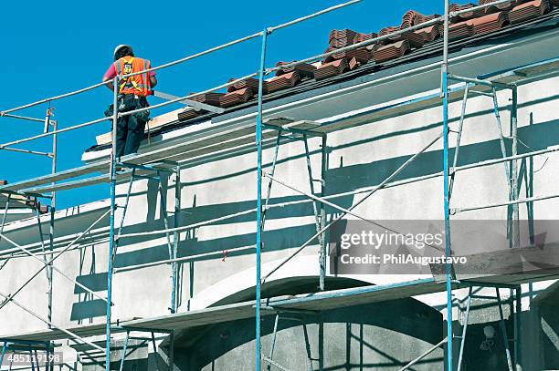 worker protecting wall with flashing in california - flashing weatherproofing stock pictures, royalty-free photos & images