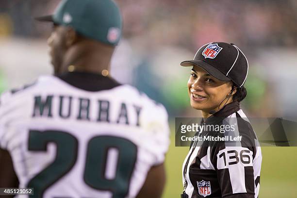 Head linesman Maia Chaka talks to DeMarco Murray of the Philadelphia Eagles during the game against the Baltimore Ravens on August 22, 2015 at...