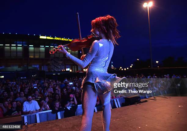 Lindsey Stirling performs during Billboard Hot 100 Festival - Day 2 at Nikon at Jones Beach Theater on August 23, 2015 in Wantagh, New York.