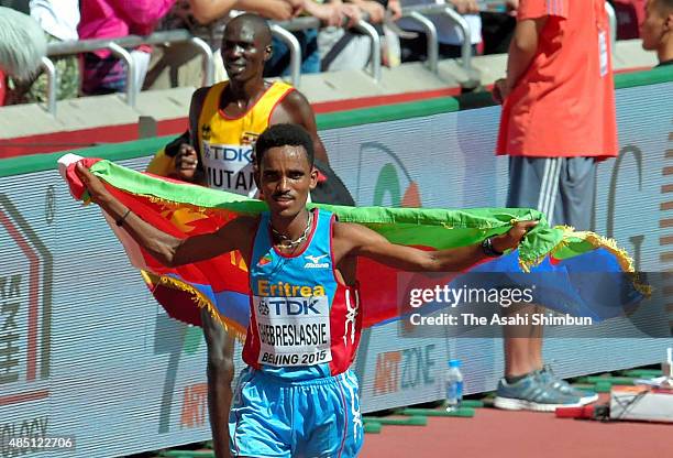 Ghirmay Ghebreslassie of Eritrea celebrates winning the gold medal in the Men's Marathon during day one of the 15th IAAF World Athletics...